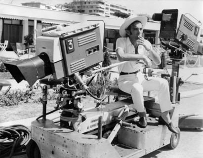 Charles AZNAVOUR smokes on a camera dolly, 1968