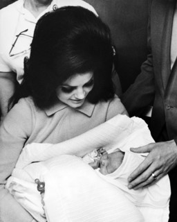 Elvis PRESLEY with his wife and daughter leaving the Baptist Hospital, 1968