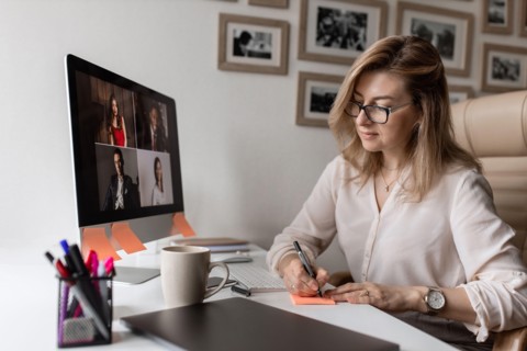 Beautiful woman work from home and have conversation with her subordinates