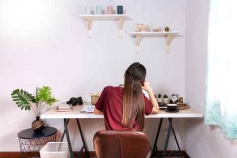 Attractive young beautiful asian woman Entrepreneur or freelancer working at home with laptop business reports and online communications on living roo