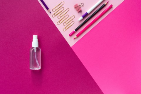 Top view of school stationery and sanitizer and on a multicolored background. Back to school 2020 flat lay and Copy space