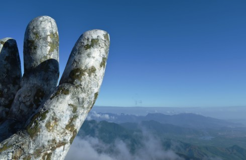 Danang Vietnam January 6, 2020 : giant hands holding bridge or golden bridge at Ba Na hills unique landmark in Vietnam