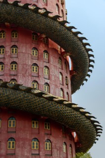 The part of pink tower with giant dragon at Wat SamPhran - Dragon temple, Nakhon Pathom, Thailand