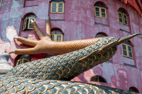 Nakhon Pathom, Thailand-February, 2020:Wat Samphran Dragon Temple in the Sam Phran District.Buddhist temple has a dragon wrapped around it.