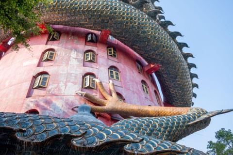 Nakhon Pathom, Thailand-February, 2020:Wat Samphran Dragon Temple in the Sam Phran District.Buddhist temple has a dragon wrapped around it.