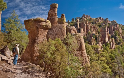 Hiker at rock pinnacles on Hailstone Trail in Chiricahua National Monument, Arizona, USA