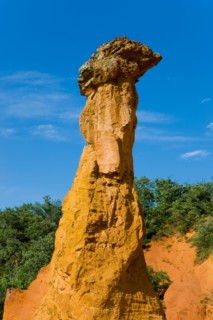 Rustrel France Provence Vaucluse sienna rock ocher erosion cliff sculptures cliff pillars trees wood forest,