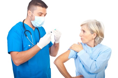 Doctor man with mask preparing syringe for vaccination senior patient isolated on white background