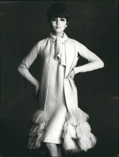 Mar. 03, 1965 - Paris dressmakers show Spring and Summer collections. Photo shows Silk evening dress and coat trimmed with ostrich feathers at the bottom. Designed by Pierre Cardin.
