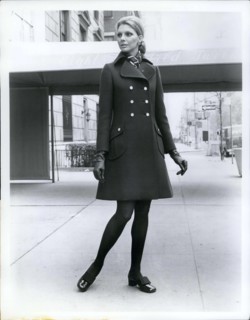 Jun. 15, 1969 - The little coat is still big news for Fall '69 from Originala, a brown double buttoned coat with lots of shaping has a regency collar and slanted patch pockets shoes by Pierre Cardin M...