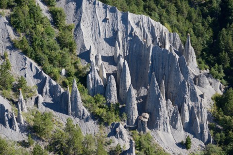 HOODOOS IN A FOREST (aerial view). Théus, Hautes-Alpes, France.