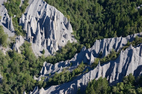 HOODOOS IN A FOREST (aerial view). Théus, Hautes-Alpes, France.