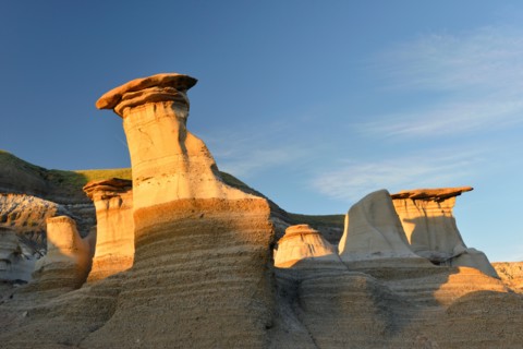 Geological formations known as 'hoodoos'; the result of erosion. Drumheller, Alberta, Canada.