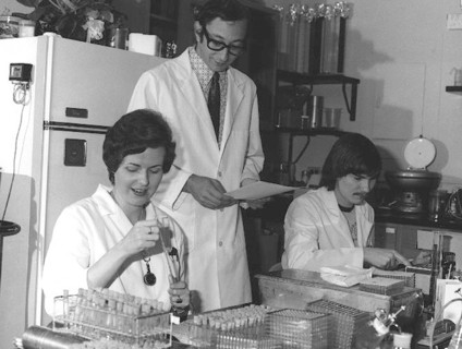 CDC Laboratorians. IMGSETINF, Lab technicians reading and checking serologies to determine presence of influenza A/NJ/8/76 (Swine Flu) and registering antibody rise to the swine influenza virus during...