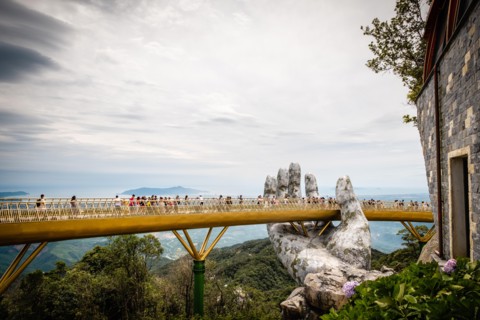 The Golden Bridge /Vietnamese: C?u Vàng) is a pedestrian bridge located in the Sun World resort in Bà Nà Hills near Da Nang in Vietnam.