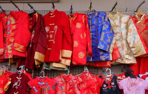 Chinese male traditional dresses called changshan, lower row are female dresses called cheongsam or qipao, usually worn during chinese celebration