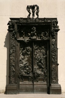 The Gates of Hell (La Porte de l'Enfer) by French sculptor Auguste Rodin seen in the garden of The Musee Rodin in Paris, France.