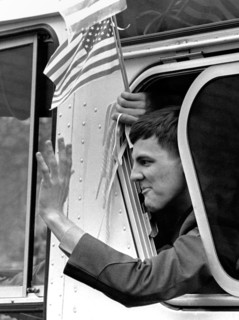 A former American hostage held by Iran waves from a buses during a welcome home parade along Pennsylvania Avenue January 27, 1981 in Washington, DC. Fifty-two Americans were held hostage for 444 days ...