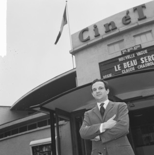 French director Francois Truffaut for cinema Cinétol, where his film plays [Le Peau Douce?] during Nouvelle Vague festival. [on billboard film by Claude Chabrol Le Beau Serge] Date: March 15, 1965 Loc...