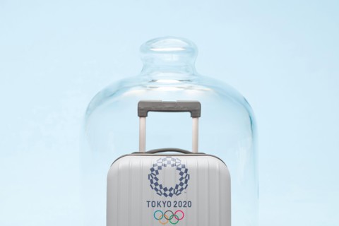 Belgrade, Serbia - 19th April 2020": suitcase with Tokyo 2020 Olympic rings in quarantine, coronavirus and travel restrictions concept.