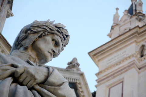The statue of Dante Alighieri, author of the Divine Comedy, in front of the Basilica of Santa Croce in the heart of Florence.