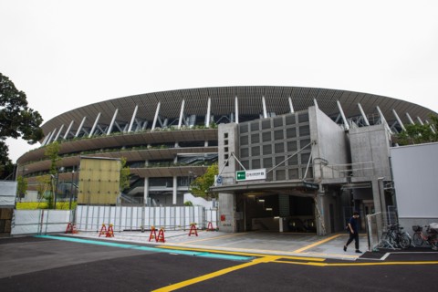 Tokyo, Japan. 21st July, 2020. A man walks outside of a subway station at the Japan National Stadium in Shinjuku City which will be use for the Olympic Games Tokyo 2021.Due to the Covid-19 outbreak, t...