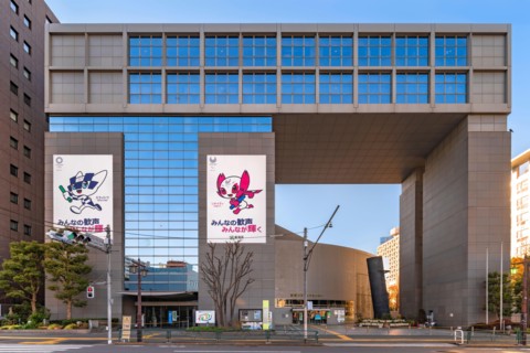 tokyo, japan - january 02 2021: Shinjuku Cosmics Center building decorated with posters of the 2020 Olympic and Paralympic Summer Games depicting the
