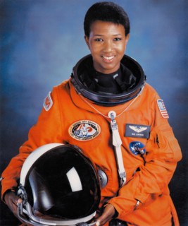 Official portrait of NASA STS-47 Spacelab-J Space Shuttle Endeavour mission prime crew astronaut Dr. Mae Jemison in an orange spacesuit at the Johnson Space Center July 1, 1992 in Houston, Texas. Jami...