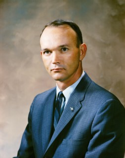 Portrait of astronaut Michael Collins in a business suit.