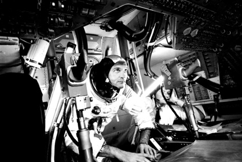 Photograph of the pilot Michael Collins at Apollo 11 Command Module, practicing docking hatch removal from CM simulator at NASA Johnson Space Center, Houston, Texas, June 28, 1969. Image courtesy Nati...