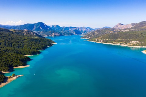 Panoramic scenic view of Serre-Poncon Lake and Alps in southeast France