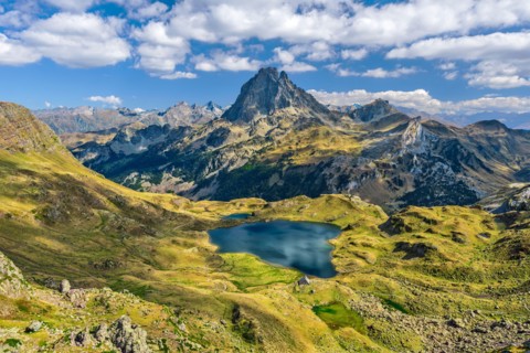 View at Ossau valley from the mountain pass Ayous in Franch Atlantic Pyrenees, as seen in October. Lake Gentau is at foreground of the famous Pyrenean