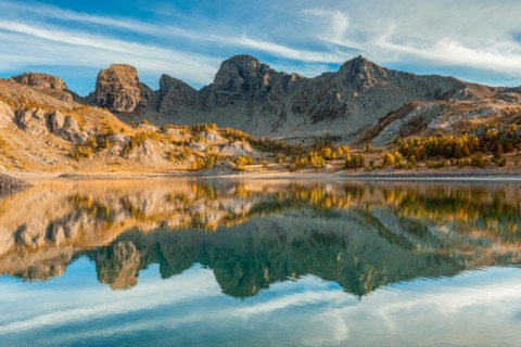 France - Provence - Haut Verdon - Reflection of the Tours du Lac in the Lac Allos.