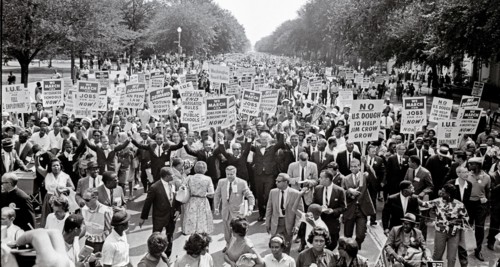 Leaders of the 1963 March on Washington for Jobs and Freedom raise their hands together as they move along Constitution Avenue in Washington, DC on August 28, 1963. Some of the leaders in the march, f...