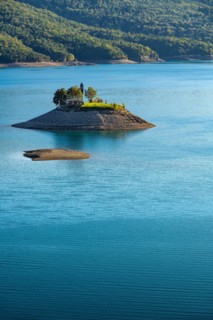 The Saint Michel Chapel and Serre Poncon lake. Saint Michel Bay, Hautes Alpes, Southern French Alps, France