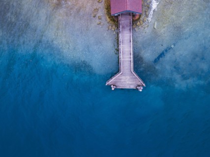 beautiful aerial landscape of the lake Annecy with top view of wooden pier, France