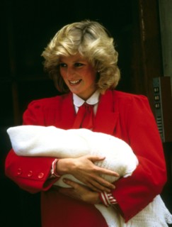 Princess Diana, Princess of Wales, smiles as she carries her newborn baby, Prince Harry, when she leaves St. Mary's Hospital in London in September 1984.