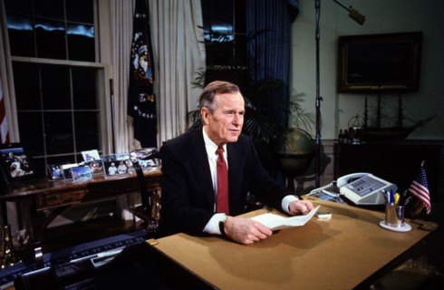 Washington, District of Columbia, USA. 25th Dec, 1991. United States President George H.W. Bush poses for photographers after delivering an address to the nation from the Oval Office of the White Hous...