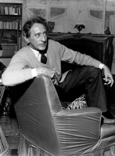 Jean Cocteau sitting in his study