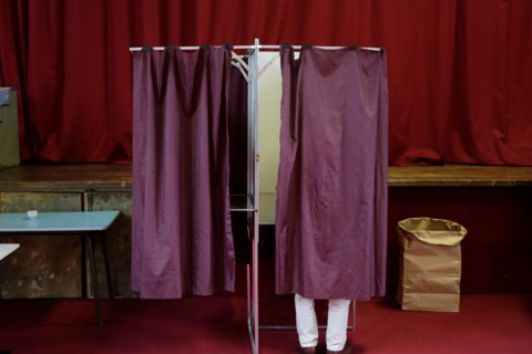 Paris, France. 07th May, 2017. A voter makes his decision inside the voting booth. Around 47 Million French people are called to the ballot boxes to elect the next President of France. The independent...