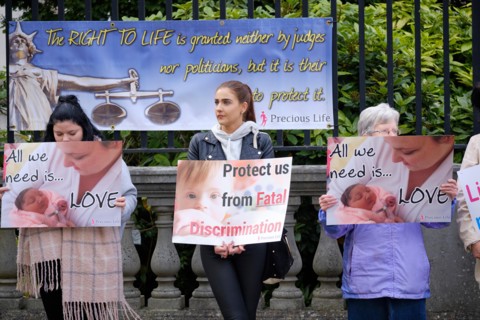 Pro life protesters outsider the Belfast High court with signs, as Northern Ireland abortion laws are being challenged