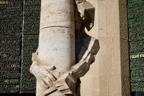 A sculpture of Jesus on the passion facade of La Sagrada Familia in Barcelona, Spain