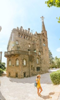28 JULY 2018, BARCELONA, SPAIN: Tourist traveler woman enjoying view of the Bellesguard tower architecture in Barcelona