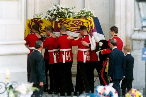 The coffin of the Princess of Wales is carried into Westminster Abbey, followed by the Prince of Wales and Prince Harry.