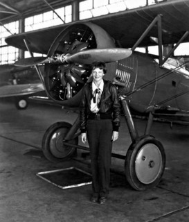Aviation pioneer Amelia Earhart poses with her airplane in a hangar July 30, 1936. Earhart was the first female aviator to fly solo across the Atlantic Ocean