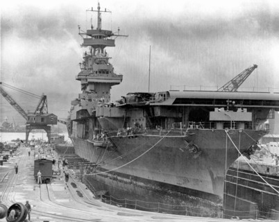 The U.S. Navy aircraft carrier USS Yorktown (CV-5) in Dry Dock No. 1 at the Pearl Harbor Naval Shipyard, 29 May 1942, receiving urgent repairs for damage received in the Battle of Coral Sea. She left ...