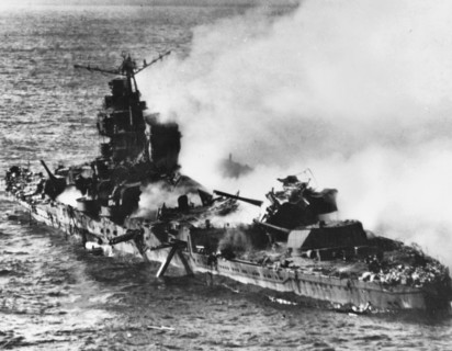 The burning Japanese cruiser Mikuma, 6 June 1942.Japanese heavy cruiser Mikuma, photographed from a USS Enterprise (CV-6) SBD aircraft during the Battle of Midway, after she had been bombed by planes...