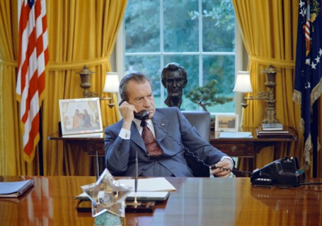 June 23, 1972. President Nixon seated at his desk, family photos and the Lincoln bust statuette are visible behind him.  Images taken while a campaign documentary was being filmed.