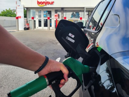PARIS, FRANCE - JUNE 2022: Refueling a car with E10 super at a french gas station