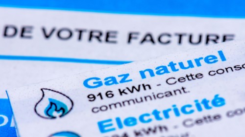 Rise of energy prices in France: close-up of a French invoice with details of the natural gas and electricity consumptions to be paid measured in kWh